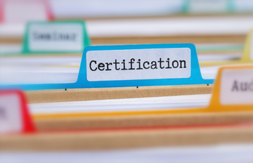 File folders with one of the tabs reading "Certification"
